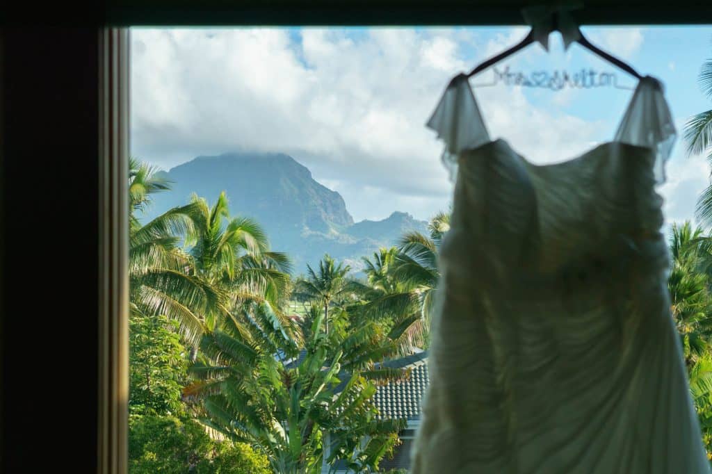 Wedding dress with Kauai landscape in the background.