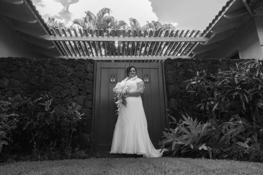 Bride posing in a garden.