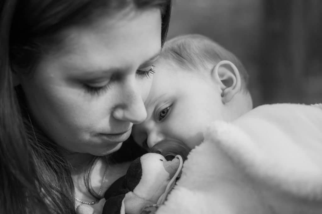 Mother and daughter snuggling.