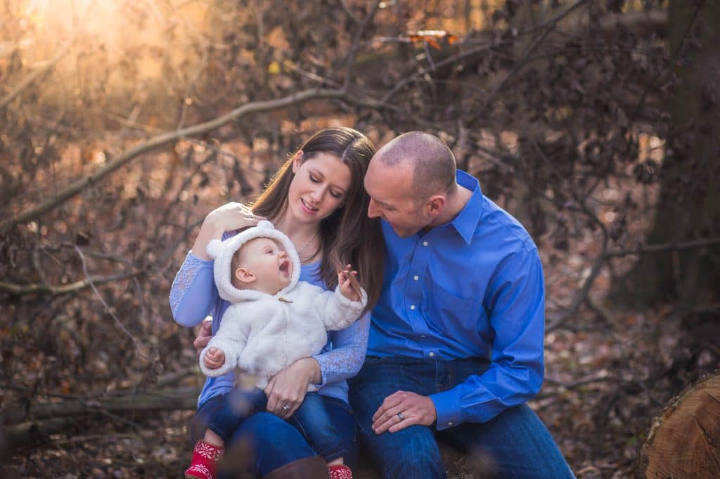 Parents looking at daughter.