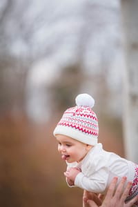 Cute toddler sticking her tongue out.