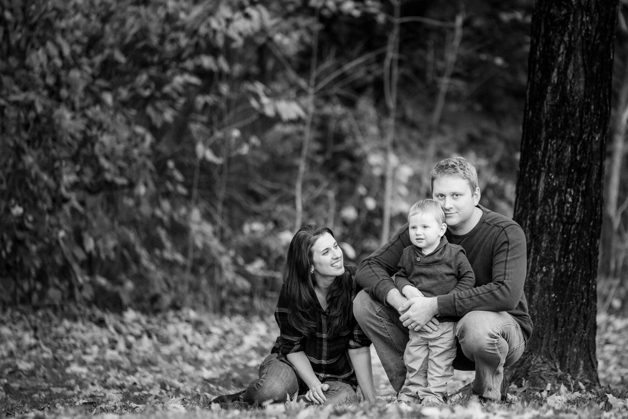 Father, mother and son hugging.