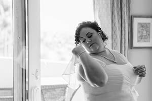 Bride fixing her veil.
