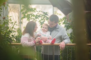Family in a greenhouse.
